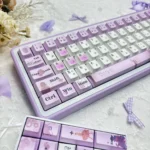 Official Violet Evergarden PBT keycaps, multiple angles. Elegant violet, blue, typewriter motifs evoke nostalgic artistry.