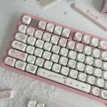 A whimsical wishing bottle pink MOA keycap set displayed from various angles, highlighting its enchanting design and adorable pink hues.