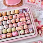 Close-up of Yumeiro Patissiere keycaps, showcasing sweet anime characters and pastel dessert designs from various angles in this exclusive PBT set.