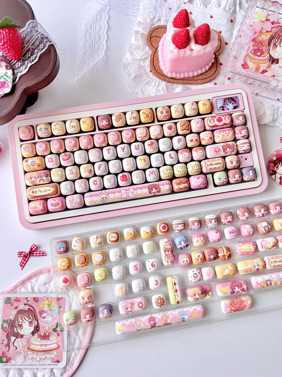 Exclusive Yumeiro Patissiere Keycaps PBT set, showcasing sweet pastel anime characters and dessert designs in a playful wonderland theme for fans.