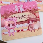 Close-up of Yumeiro Patissiere: Chibi Ver. Character Mouse Pad & Desk Mat, highlighting whimsical pastel cupcake and macaroon motifs with a dreamy anime dessert style.