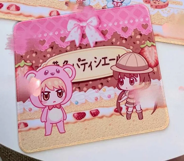 Close-up of Yumeiro Patissiere: Chibi Ver. Character Mouse Pad & Desk Mat, highlighting whimsical pastel cupcake and macaroon motifs with a dreamy anime dessert style.