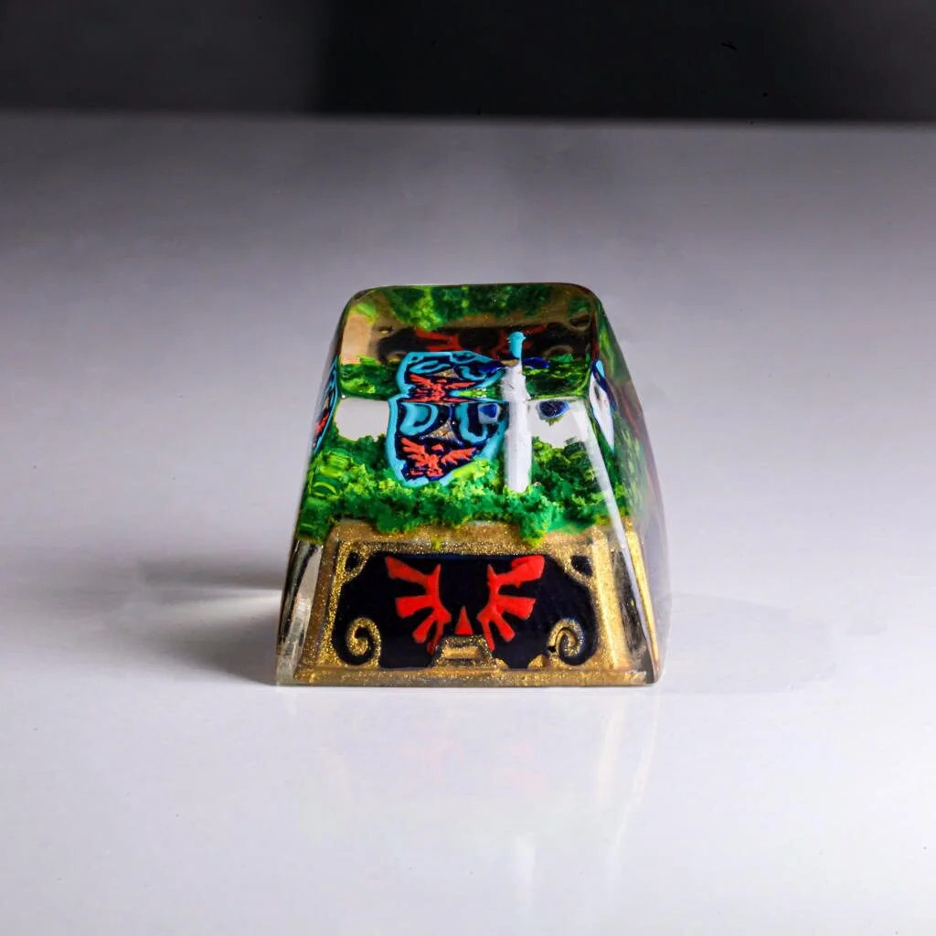 Premium Zelda Hylian Shield Master Sword keycap, featuring its iconic design and detailed craftsmanship from various angles.