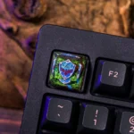 Detailed Zelda Hylian Shield 1U keycap. This premium artisan piece features the iconic blue and silver shield, perfect for gaming keyboard customization.