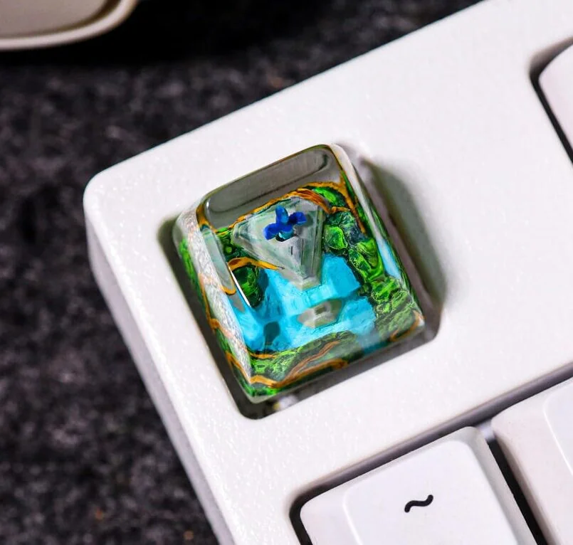 Close-up of a premium handcrafted The Legend of Zelda: Chibi Ver. Master Sword Transparent Keycap, showcasing its intricately sculpted 3D design in translucent resin with vibrant backlit illumination.