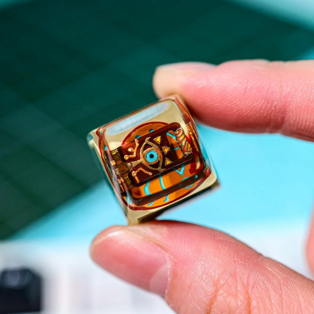 Close-up of the handcrafted The Legend of Zelda: Sheikah Transparent Keycap, revealing its intricate 3D sculpted fantasy art and glowing mystical aesthetic.
