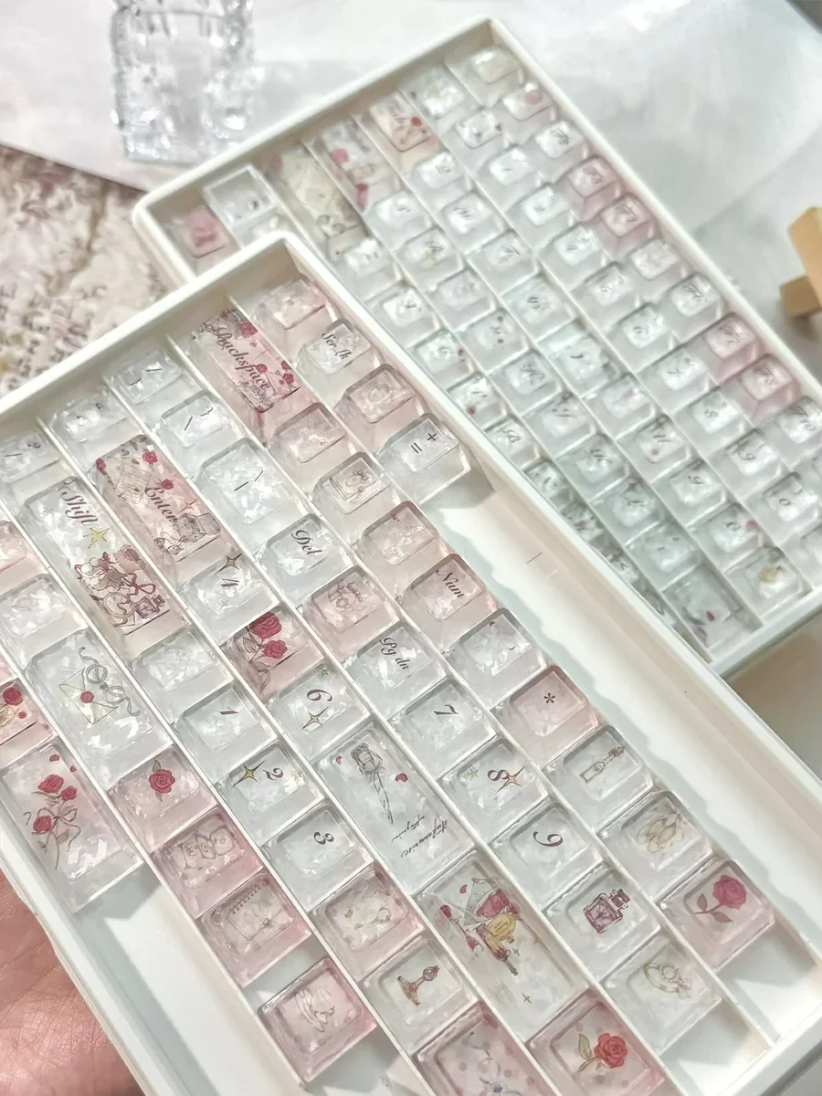 Multiple angles of an Artisan Rose Keycap Set, showcasing its exquisite frosted and crystalline translucent PC material with delicate carbon texture.
