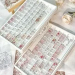 Artisan Rose Keycap Set in various angles, showcasing its frosted elegance, crystalline rose, and translucent PC, for personalized mechanical keyboards.