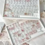 Artisan Rose Keycap Set gallery: Frosted crystalline rose motifs on translucent PC. Carbon texture accents, all angles, offer personalized elegance for keyboard.