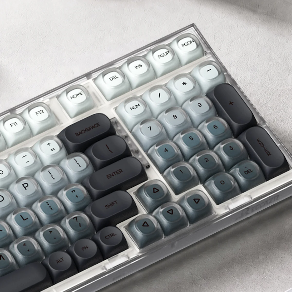 A close-up view of an Ash Island custom keycap set, revealing its serene misty landscape design and muted cool tones. This artistic, premium keycap adds artistic touch.