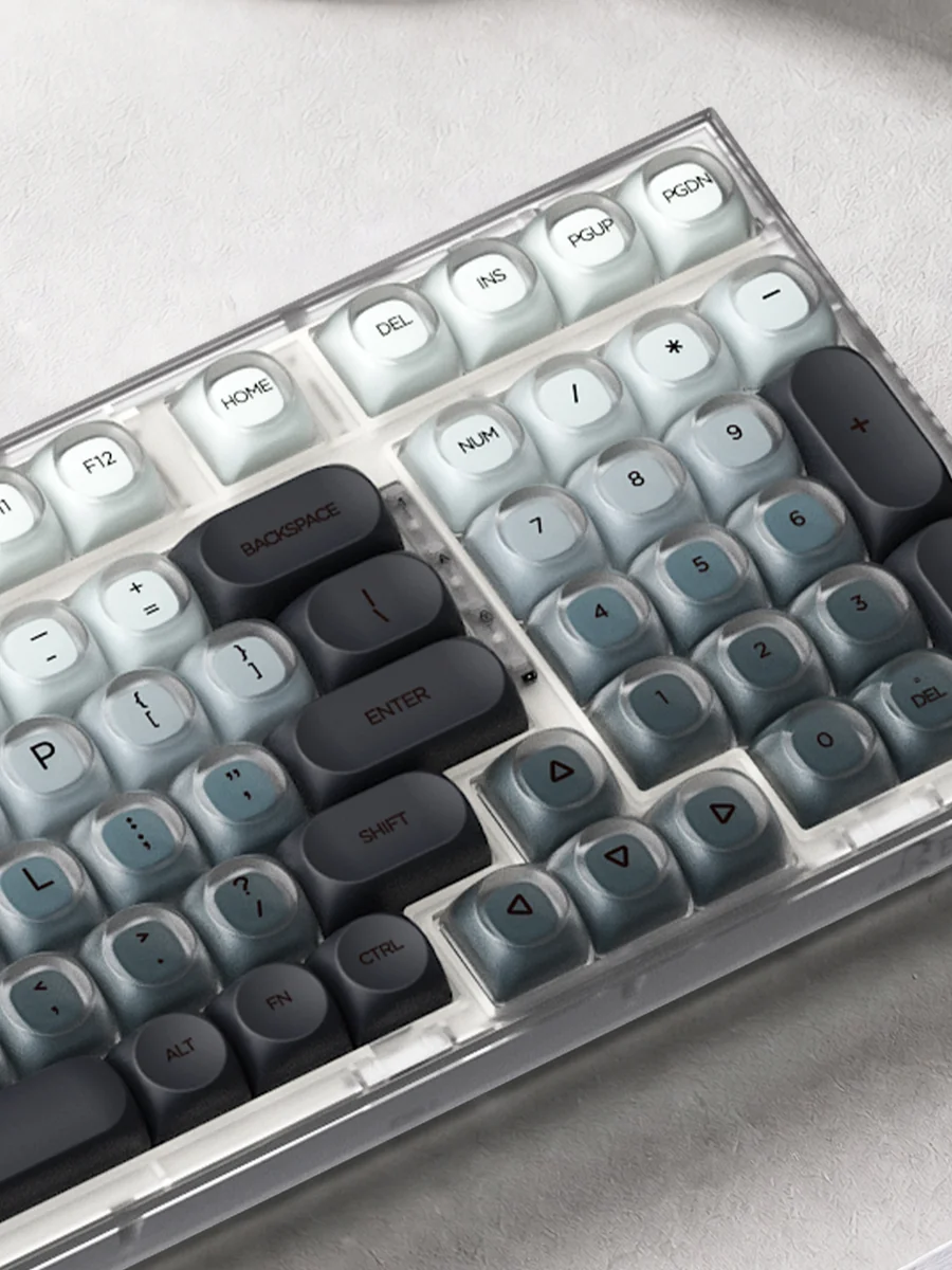 Ash Island Keycap Set: Serene, artistic custom keycap set showcasing a unique misty island design. Premium, minimalist aesthetic, muted cool tones.