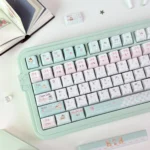 Whimsical PBT dye-sub bear keycaps set, showcasing charming honey blossom and floral in soft hues from various angles.