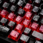 Detailed product gallery of Black-Red Carbon Fiber keycaps, showcasing the unique side-printed backlit legends, premium texture, and subtle red accents.