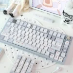 Close-up of the premium Whimsical Blue Bear Bake PBT Dye-Sub Cherry Keycap Set, highlighting the charming blue bear and bakery-themed illustrations.