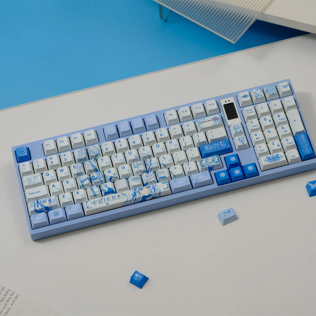 Frieren: Beyond Journey's End keycap set close-up showing vibrant, meticulously crafted iconic characters and symbols from various angles.