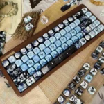 Ethereal Blue Mist PBT Dye-Sub Keycaps set, showcasing various angles of dreamy blue hues and mystical reflections as artistic keyboard decor.