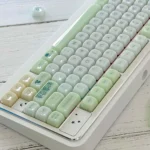 A close-up view of the Jelly Green PC Keycap Set, highlighting its vibrant, nature-inspired MAO profile and smooth, jade-like finish from a unique angles.
