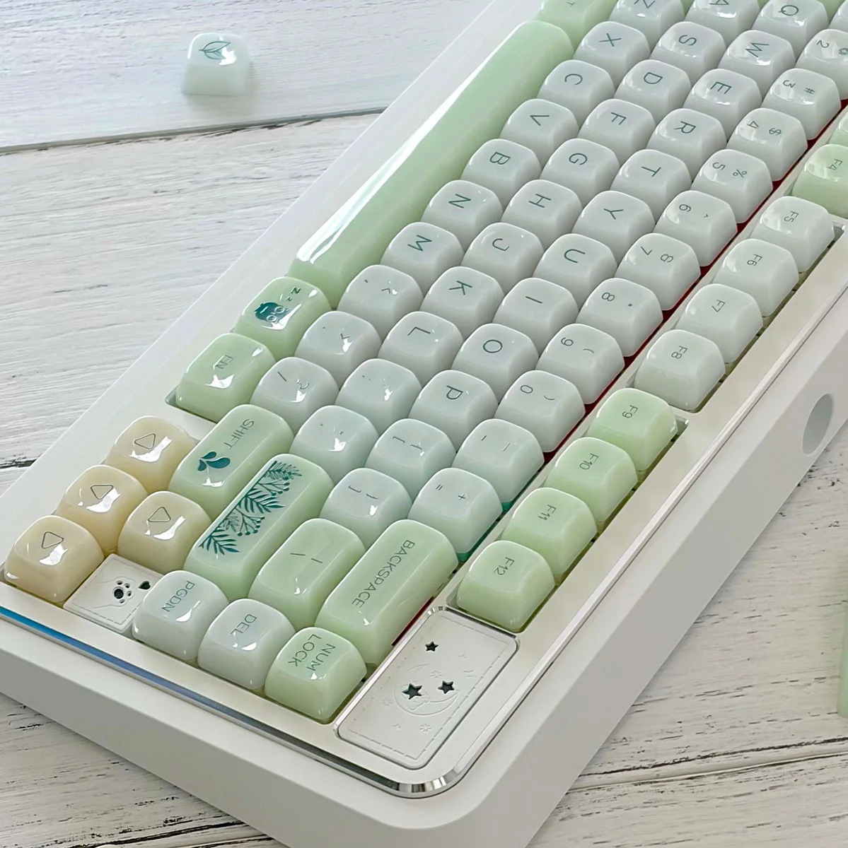 A close-up view of the Jelly Green PC Keycap Set, highlighting its vibrant, nature-inspired MAO profile and smooth, jade-like finish from a unique angles.