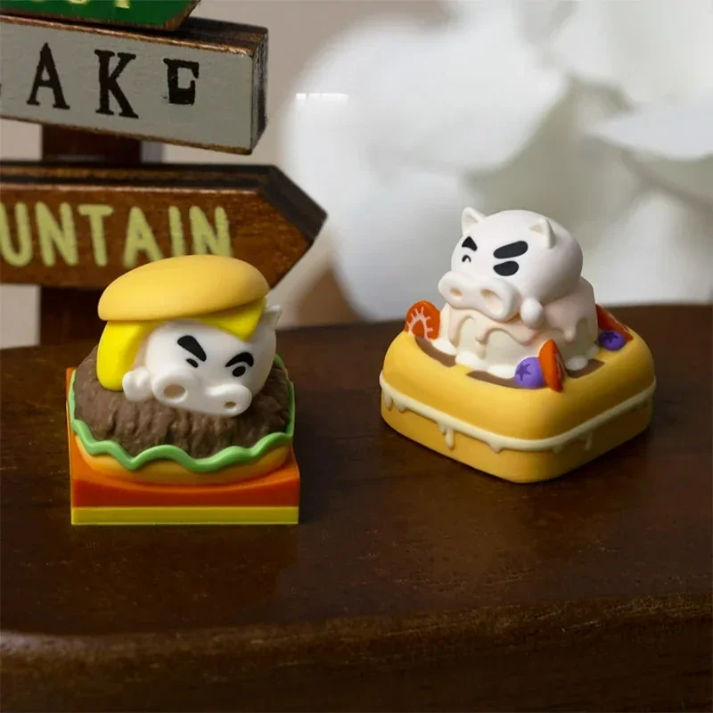 Collectible Crayon Shin-Chan Buriburizaemon artisan keycaps, showcasing whimsical burger and waffle designs from multiple playful angles.