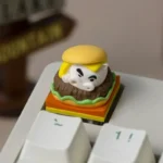 Collectible Crayon Shin-Chan Buriburizaemon artisan keycaps in playful burger and waffle designs, showcased from various angles in this delightful production.