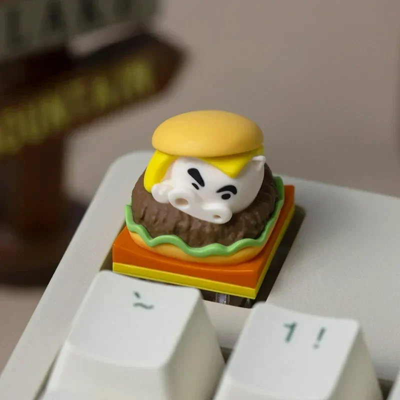 Collectible Crayon Shin-Chan Buriburizaemon artisan keycaps in playful burger and waffle designs, showcased from various angles in this delightful production.