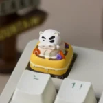 Whimsical Buriburizaemon Crayon Shin-Chan artisan keycap gallery, showcasing delightful burger and waffle designs from various angles.