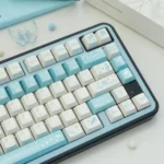 Butterfly Lovers Keycaps, showcasing pearlescent iridescent blue-white butterfly designs from multiple angles. Premium PBT artistry.