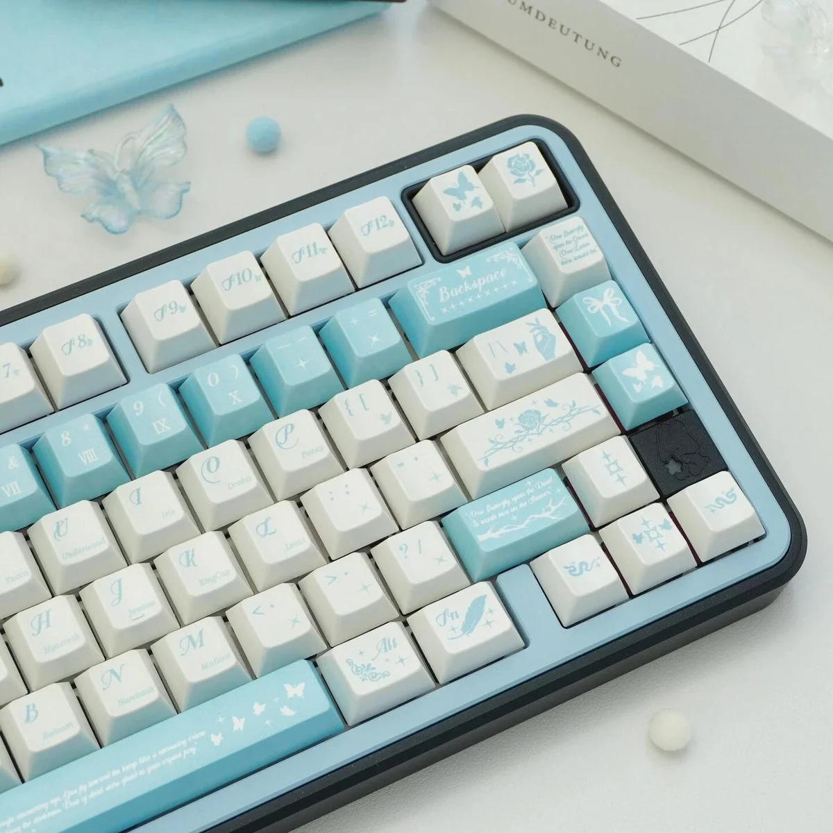 Butterfly Lovers Keycaps, showcasing pearlescent iridescent blue-white butterfly designs from multiple angles. Premium PBT artistry.
