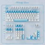 A collection of Butterfly Lovers Keycaps showcasing their iridescent blue-white pearlescent finish and delicate artistry from various angles.