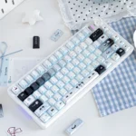 Whimsical Cat Baker PBT Dye-Sub keycaps from a unique angle, showcasing charming feline chefs, warm pastel kitchen scenes, and intricate baking details.