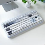 Whimsical FOA Little Cat Baker PBT dye-sub keycap set (145 keys) in a charming box, showing playful feline bakers.