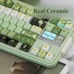 Exquisite handcrafted Night Astrology ceramic keycaps, featuring mystical deep green glaze and celestial night sky designs from multiple angles.