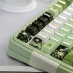 Exquisite handcrafted Night Astrology ceramic keycaps in mystical deep green glaze, showcasing celestial elegance from multiple angles.