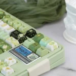 Exquisite handcrafted Night Astrology ceramic keycaps, showcasing a mystical deep green glaze and celestial night sky details from various angles.
