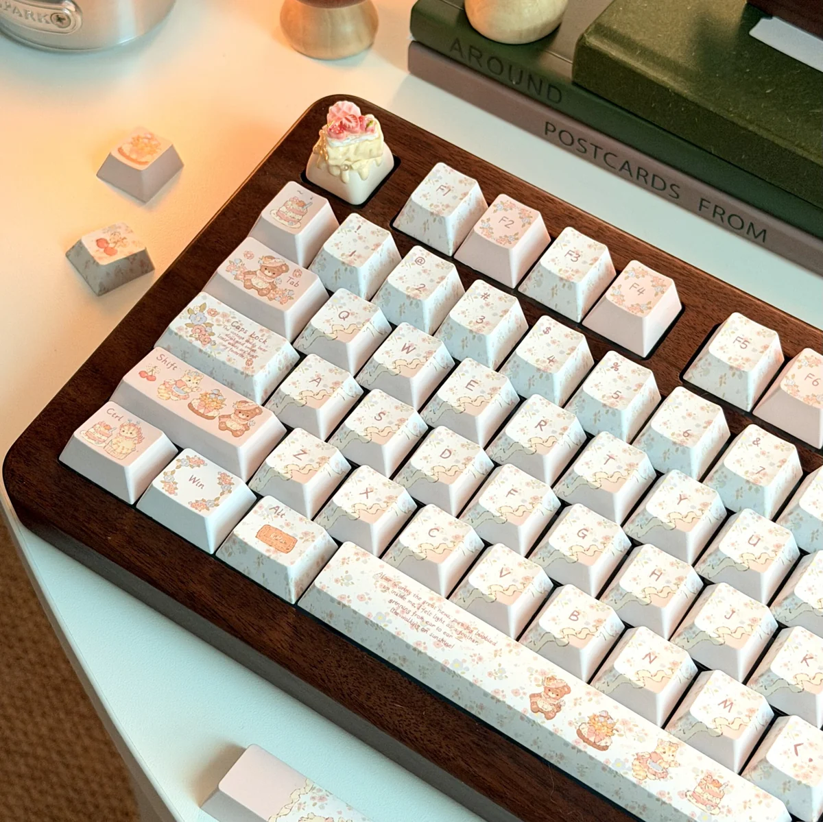 Artistic view of the Charming Cat & Spring Dye-sub PBT Keycap Set, displaying whimsical cats and soft pastel spring flowers.