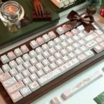 Charming Cat & Spring Dye-sub PBT Keycap Set, an artistic display of whimsical cats and soft pastel spring flowers, perfect for any keyboard.