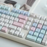 Charming Cheese Bunny PBT+PC MOA profile keycaps close-up, revealing playful pastel pink rabbit and vibrant yellow cheese designs on a keyboard.