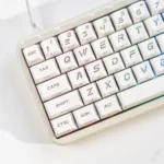 Frost Cold & Dark Night Cherry keycap set, shown from various angles, highlighting its sleek dark aesthetic and large.