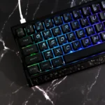 Frost Cold & Dark Night Cherry keycap set, viewed from a striking angle, highlighting large illuminated legends and sleek dark aesthetic.