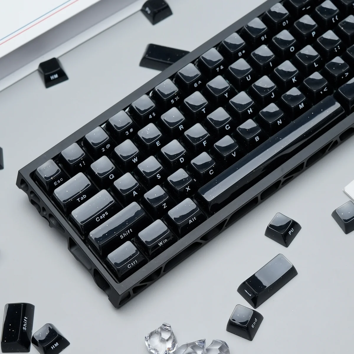 Multiple views of the Celestial Crystal Jelly Starry Keycap Set, showcasing its deep black, crystal-clear, jelly-like finish, cosmic starlight.