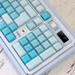A playful CSA Jelly Pudding Keycap Set, showing various translucent, vibrant keys from different angles. Highlights the ergonomic profile and food-inspired.