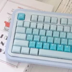 An angled view of the CSA Jelly Pudding keycap set, revealing its vibrant, translucent jelly aesthetic and ergonomic CSA profile. Playful and smooth.