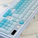 A playful CSA Jelly Pudding keycap set displayed from various angles, showcasing its vibrant, translucent design and ergonomic profile.
