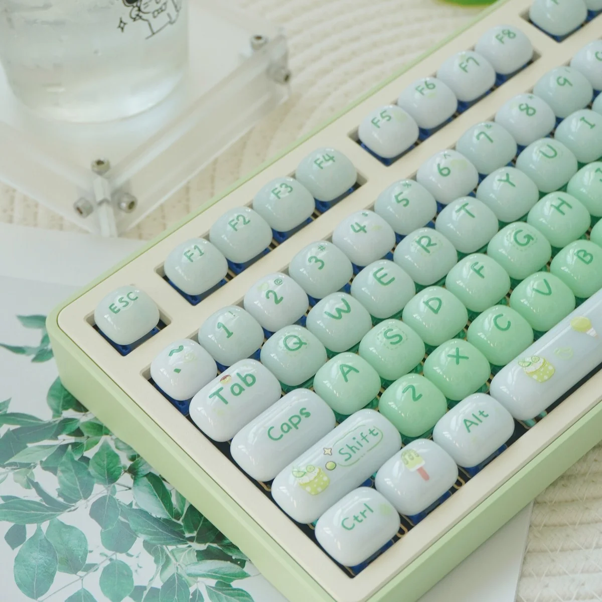 Sweet Nostalgia Dessert Keycap Set close-up from a playful angle, highlighting its glossy PC finish and lush green gradient.