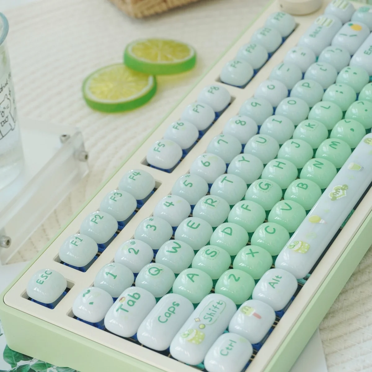 A playful gallery image of the Sweet Nostalgia Dessert Keycap Set, highlighting its glossy PC finish and lush gradient green. The rounded, dessert-inspired.