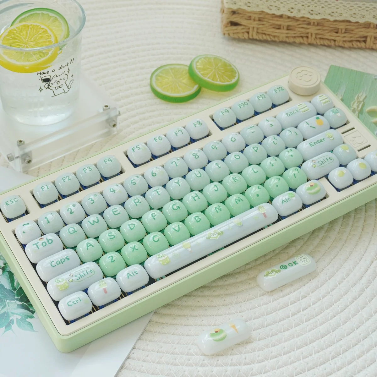 A playful Sweet Nostalgia Dessert Keycap Set, showcasing a glossy PC gradient finish in lush green hues, with rounded, jelly-like keycaps.