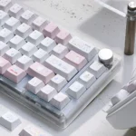 Different angles of the whimsical Fairy Garden Keycap Set, showcasing charming pastel storybook illustrations and its unique childhood wonder theme.
