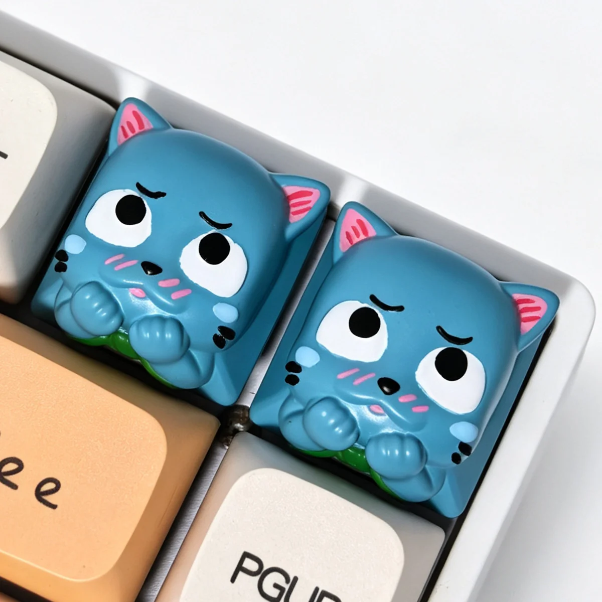 A playful, handcrafted Fairy Tail Happy resin keycap, viewed from a unique angle, highlighting its vibrant 3D details and joyful design for mechanical keyboard.