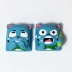 A playful, handcrafted Fairy Tail Happy resin keycap, viewed from a unique angle, showcasing its vibrant 3D details perfect for joyful keyboards.