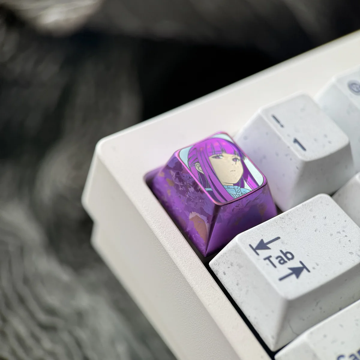 Premium Fern titanium artisan keycap, captured from multiple angles, reveals vibrant character art on polished titanium, a timeless journey collection.